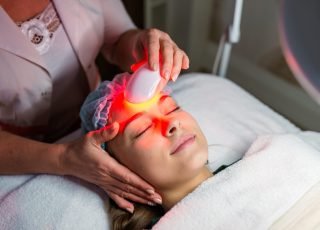 Skin Care. Young Woman Receiving Facial Beauty Treatment, Removing Pigmentation At Cosmetic Clinic. Intense Pulsed Light Therapy. IPL. Rejuvenation, Photo Facial Therapy. Anti-aging Procedures. Skin Care. Young Woman Receiving Facial Beauty Treatment, Removing Pigmentation At Cosmetic Clinic. Intense Pulsed Light Therapy. IPL. Rejuvenation, Photo Facial Therapy. Anti-aging Procedures.